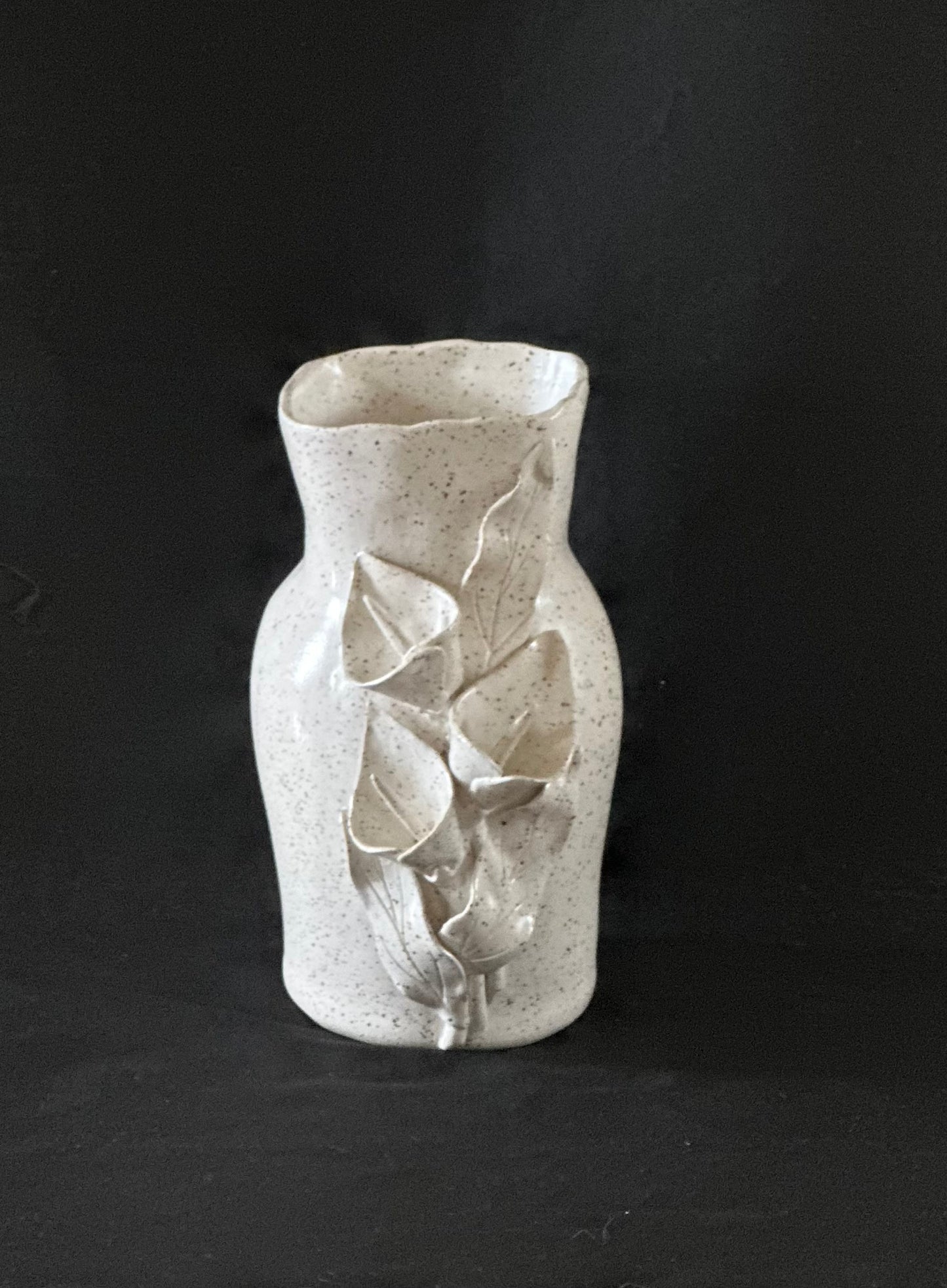 Speckled White Vase With Calla Lilies