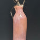 Survivor In Pink – on Wooden Stand