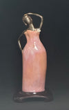 Survivor In Pink – on Wooden Stand