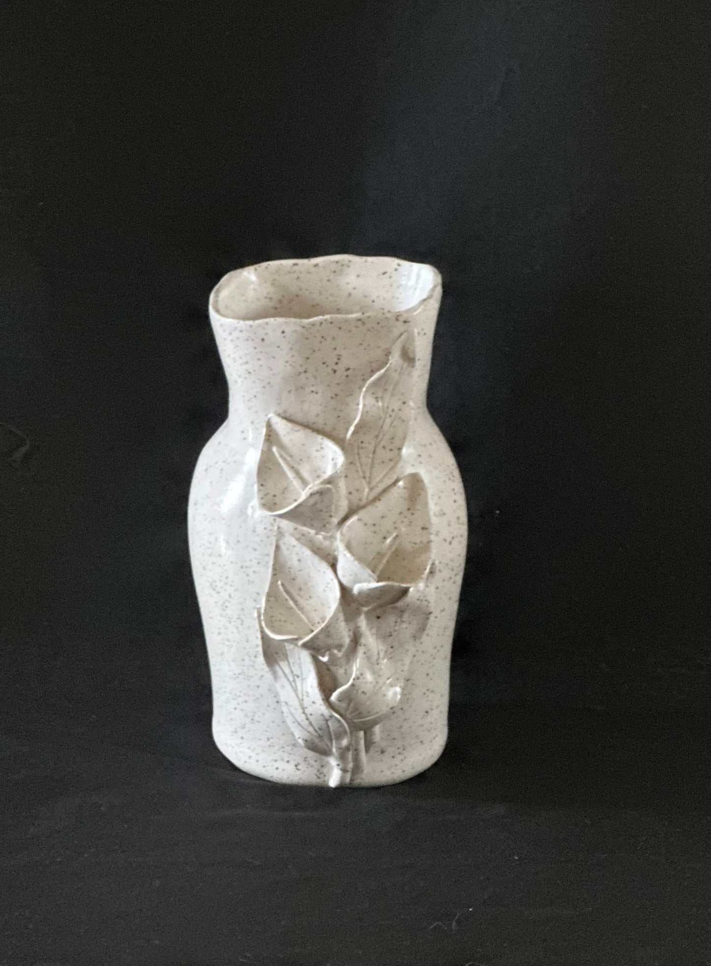 Speckled White Vase With Calla Lilies
